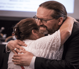 Commissioners Michèle Audette and Brian Eyolfson welcomes participants at the institutional hearings on Police Policies and Practices in Regina in June 2018.